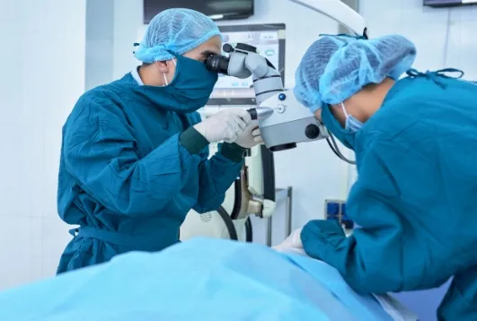 two doctors performing eye surgery