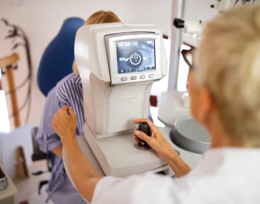 optometrist-examining-patient-in-modern-ophthalmologist