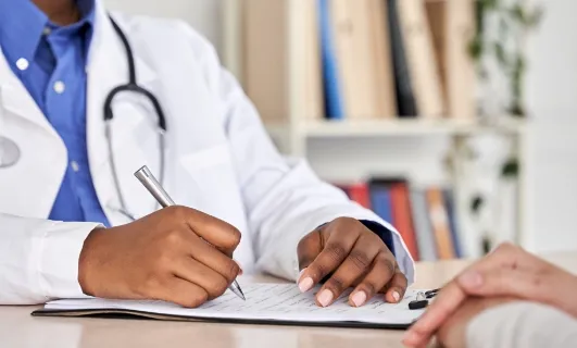 doctor consult woman patient filling medical form at appointment